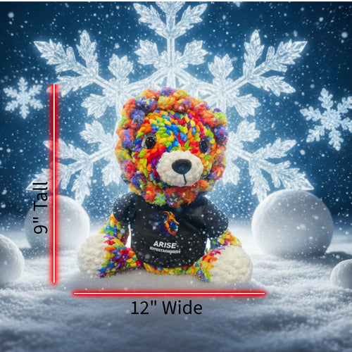 Colorful teddy bear with 'ARISE ENTERTAINMENT' text against a snowy background with snowflakes